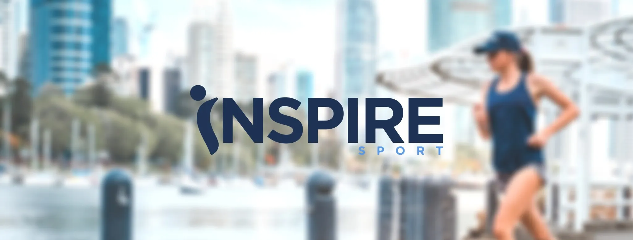 The Inspire Sport logo over a photo of a runner on a city waterfront